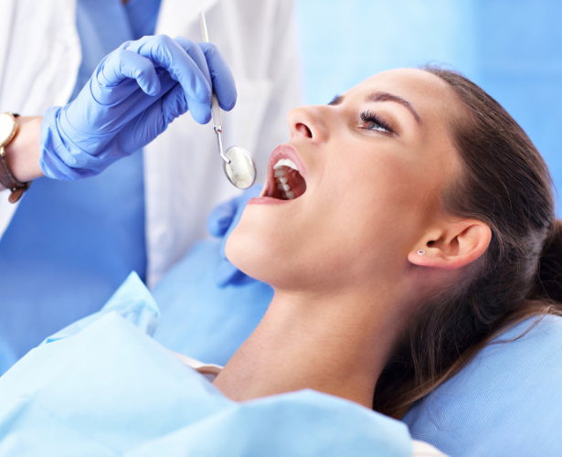 Dentist performing root canal on a patient’s molar